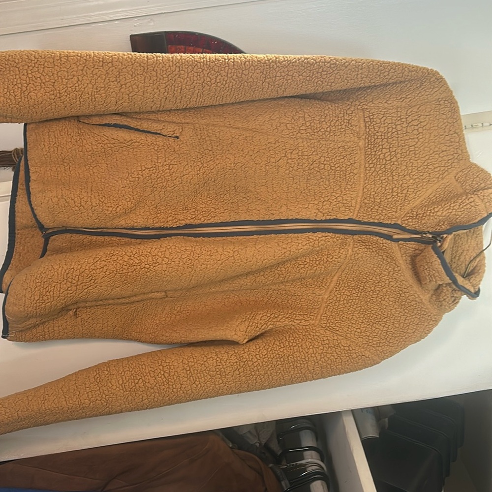 North face burnt orange fluffy jacket